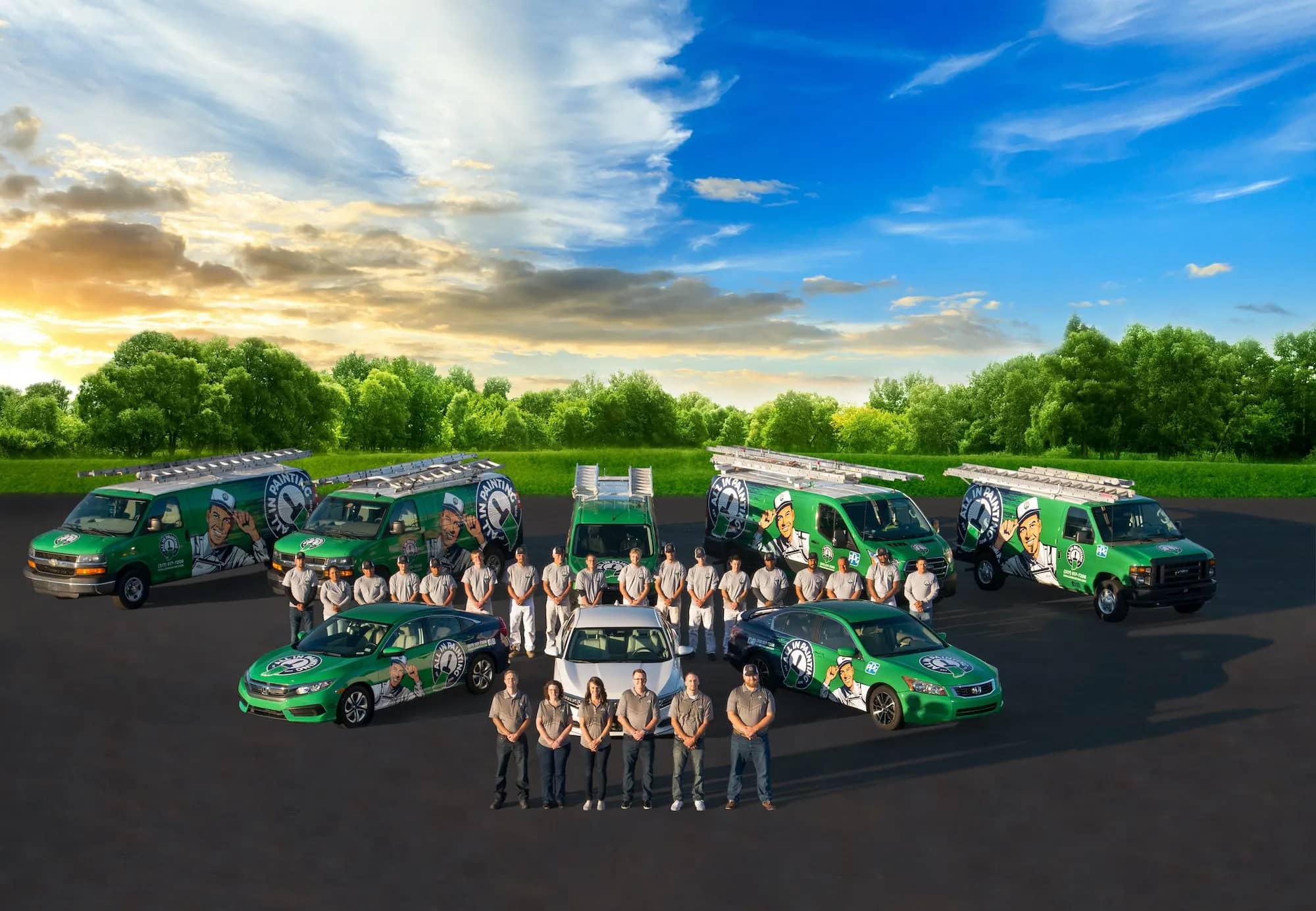 The ALL IN Painting crew and fleet lined up on the lot at sunset