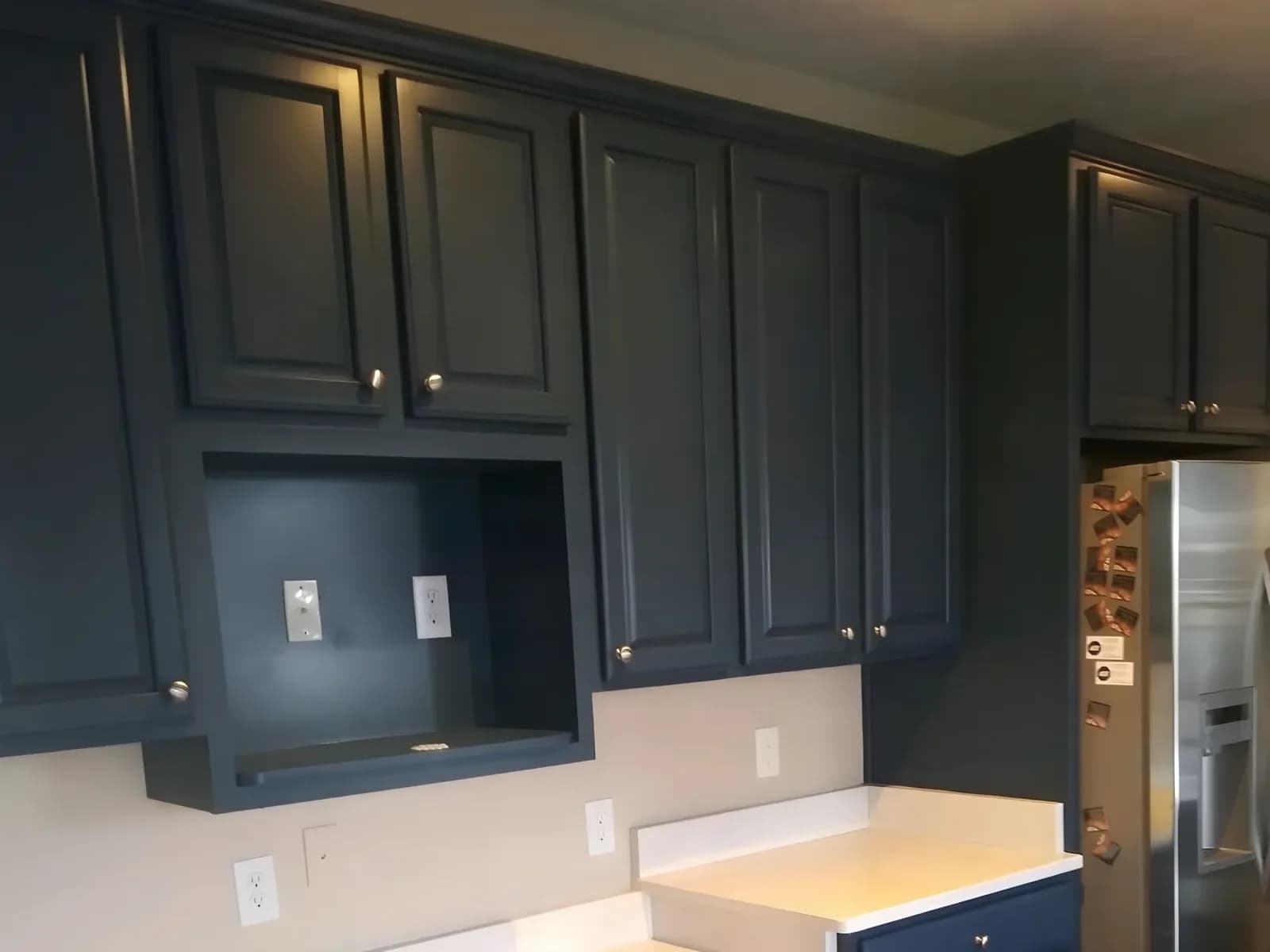 Upper cabinets painted navy