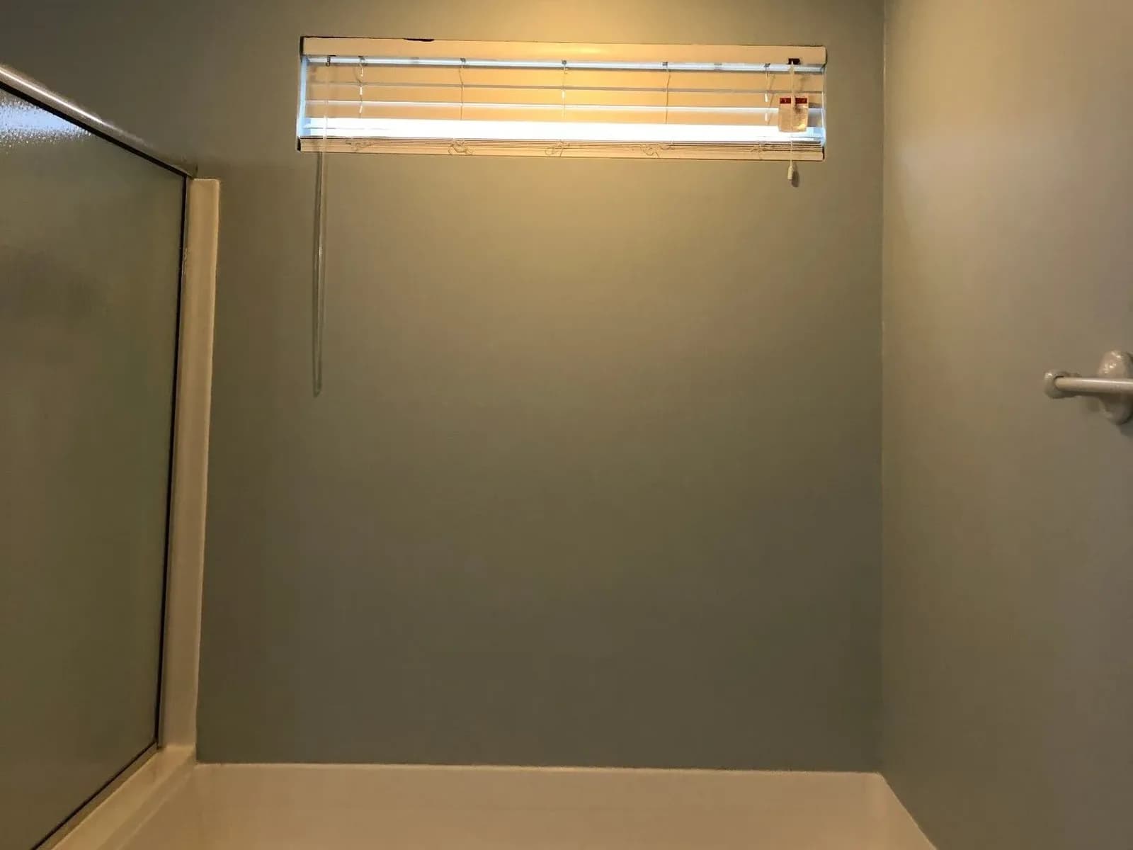 Tub surround walls repainted a soft gray
